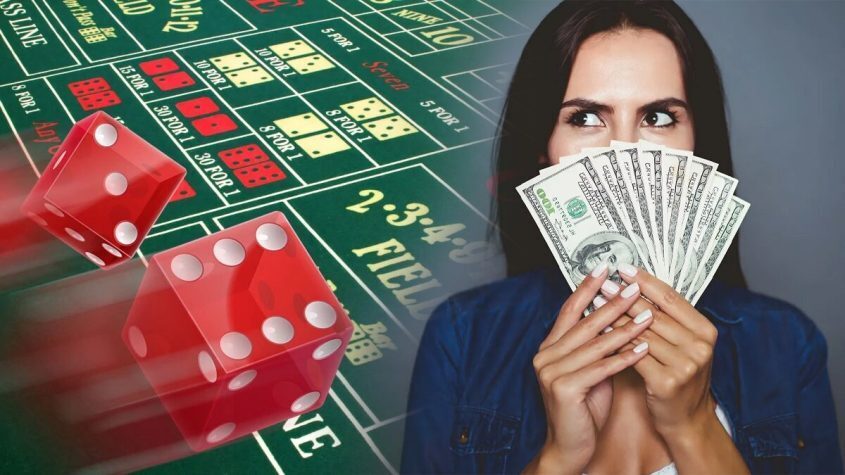 Craps Table and Woman Holding Money
